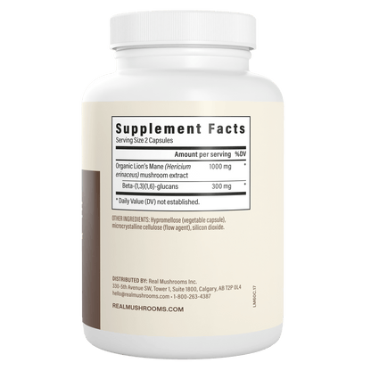 A white bottle labeled "Supplement Facts" shows details for Real Mushrooms Organic Lion's Mane Extract Capsules, listing ingredients and distributor info on the side—ideal for supporting brain health.